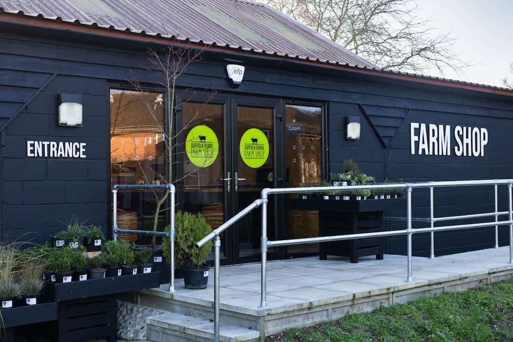 An external shot of the Suffolk Rural Farm Shop showing entrance and signage.